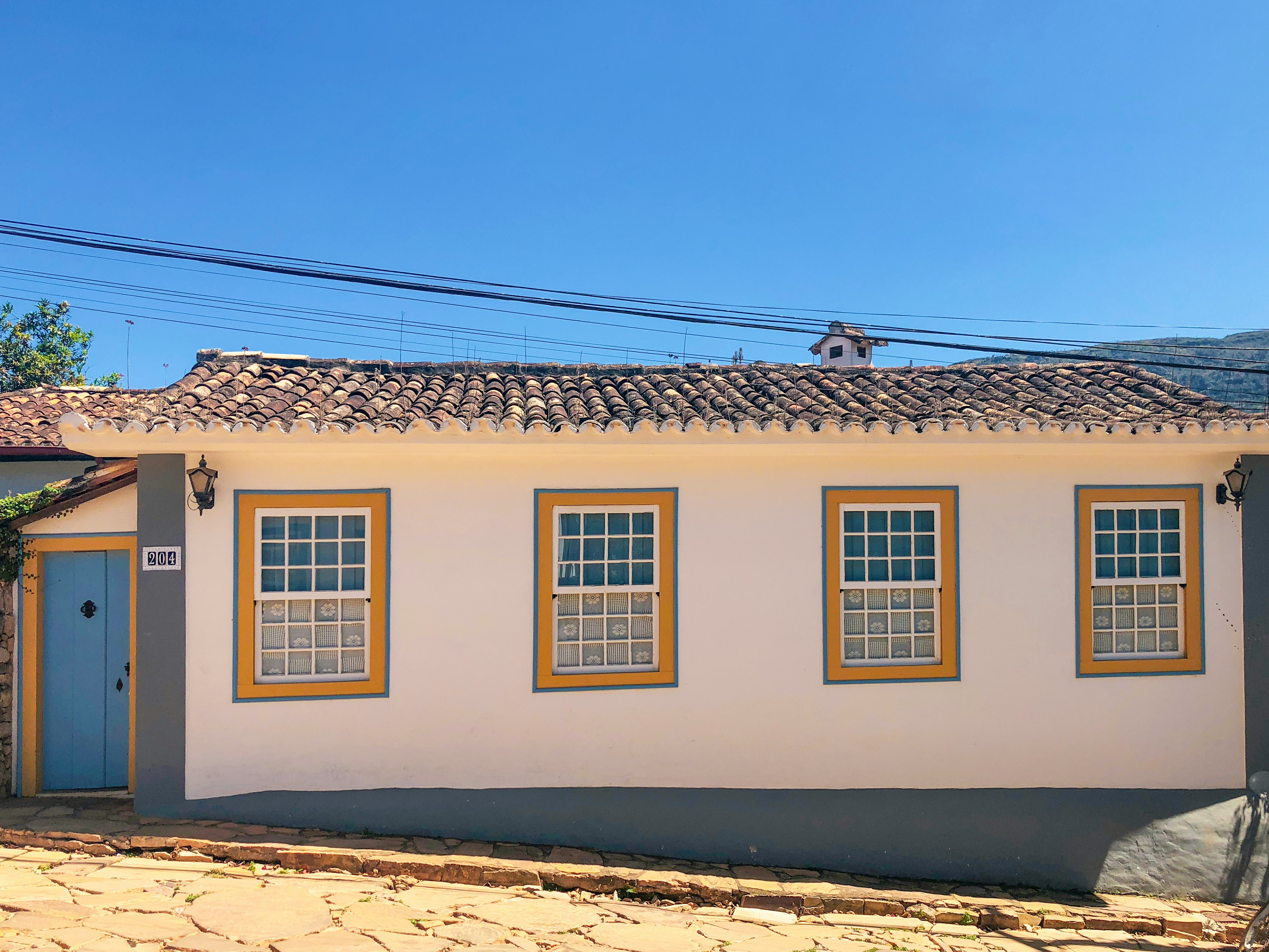 white and brown concrete house under blue sky during daytime